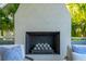 A cozy outdoor fireplace with a decorative facade, nestled amongst the lush surroundings at 301 Center St, Mount Pleasant, SC 29464