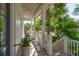 Charming front porch with comfortable seating and views of lush greenery at 301 Center St, Mount Pleasant, SC 29464