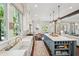 Open kitchen featuring a large island, custom cabinets, stainless steel appliances, and a view to the dining area at 301 Center St, Mount Pleasant, SC 29464