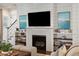 Stylish living room featuring a fireplace, built-in shelving, and comfortable seating at 301 Center St, Mount Pleasant, SC 29464