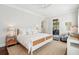 Airy main bedroom featuring a comfortable bed, stylish nightstands, and seamless access to office at 301 Center St, Mount Pleasant, SC 29464