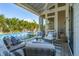 Stunning outdoor living space with plush seating and a pool view, perfect for entertaining at 301 Center St, Mount Pleasant, SC 29464