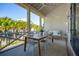 Inviting screened porch with a dining area and cozy swing, offering a relaxing outdoor space at 301 Center St, Mount Pleasant, SC 29464