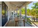 Spacious outdoor patio perfect for dining, overlooking the pool and lush landscaping at 301 Center St, Mount Pleasant, SC 29464