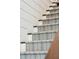Close up view of carpeted staircase with blue and gray patterned treads at 301 Center St, Mount Pleasant, SC 29464