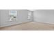 Bright bedroom with two large windows providing natural light and neutral carpet at 301 Watersglen Dr, Summerville, SC 29486