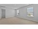 Well-lit bedroom featuring carpeted floors, two windows and a bright, airy feel at 301 Watersglen Dr, Summerville, SC 29486