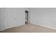 Carpeted bedroom with natural light and a doorway leading into a hallway at 301 Watersglen Dr, Summerville, SC 29486