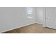 Bedroom with wood-look flooring, natural light from the window, and a closet door at 301 Watersglen Dr, Summerville, SC 29486