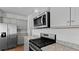 Close-up of kitchen with stainless appliances, granite counters and light gray cabinets at 301 Watersglen Dr, Summerville, SC 29486
