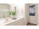 Bright bathroom featuring double sinks, modern lighting and a shower with glass doors at 305 Watersglen Dr, Summerville, SC 29486