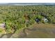 Aerial view of home surrounded by trees with views of the waterway at 3052 Seabrook Island Rd, Seabrook Island, SC 29455
