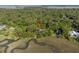 Aerial view of a home surrounded by trees on a waterway at 3052 Seabrook Island Rd, Seabrook Island, SC 29455