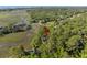 Aerial view of a marsh-front home surrounded by lush greenery and winding waterways at 3052 Seabrook Island Rd, Seabrook Island, SC 29455