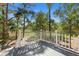 Backyard deck with scenic views of trees at 3052 Seabrook Island Rd, Seabrook Island, SC 29455