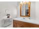 Neutral bathroom featuring a white countertop, wooden cabinets, and a framed mirror at 3052 Seabrook Island Rd, Seabrook Island, SC 29455