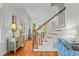 Bright foyer with hardwood floors, natural light, and a staircase at 3052 Seabrook Island Rd, Seabrook Island, SC 29455