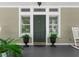 Stylish front entrance with decorative plants enhancing its curb appeal at 3052 Seabrook Island Rd, Seabrook Island, SC 29455