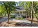 Charming home exterior featuring a welcoming front porch and lush landscaping at 3052 Seabrook Island Rd, Seabrook Island, SC 29455
