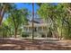 Inviting home with a covered porch, perfect for enjoying the serene surroundings at 3052 Seabrook Island Rd, Seabrook Island, SC 29455
