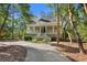 Picturesque home with a classic porch, ideal for relaxing in a peaceful setting at 3052 Seabrook Island Rd, Seabrook Island, SC 29455