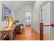 Upstairs hallway with hardwood floors and access to bedrooms at 3052 Seabrook Island Rd, Seabrook Island, SC 29455