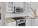 Kitchen has granite countertops, white subway tile backsplash, and stainless steel appliances at 3052 Seabrook Island Rd, Seabrook Island, SC 29455