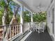 Covered porch area perfect for entertaining with views of nature at 3052 Seabrook Island Rd, Seabrook Island, SC 29455