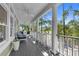 Relaxing porch with ceiling fans and wooded backyard views at 3052 Seabrook Island Rd, Seabrook Island, SC 29455
