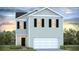 Charming two-story home featuring a two-car garage, black shutters, and a welcoming front porch at 307 Watersglen Dr, Summerville, SC 29486