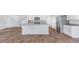 Open concept kitchen with stainless steel appliances, granite counters, island and wood-look floors at 307 Watersglen Dr, Summerville, SC 29486
