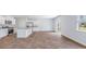 Spacious, open-concept kitchen and living area filled with natural light and stainless appliances at 307 Watersglen Dr, Summerville, SC 29486