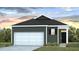 Charming one-story home with a white garage door, dark siding, complemented by manicured lawn and flowering plants at 311 Watersglen Dr, Summerville, SC 29486