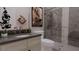 Modern bathroom with a vessel sink, framed picture, designer fixtures, and glass-enclosed tile shower at 336 Trailmore Ln, Summerville, SC 29486