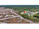 Aerial view showcases the home's location near the marshland and waterway, offering scenic tranquility at 4000 Saltwater Cir, Johns Island, SC 29455