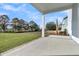 Covered back porch featuring a view of a lush green lawn, landscaping and mature trees at 4000 Saltwater Cir, Johns Island, SC 29455