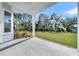 Covered back porch featuring a view of a lush green lawn and mature trees at 4000 Saltwater Cir, Johns Island, SC 29455