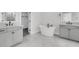 Bathroom featuring double vanities, a tub, and a walk-in shower at 4000 Saltwater Cir, Johns Island, SC 29455