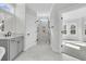 Bright bathroom with a walk-in shower and dual vanity sinks at 4000 Saltwater Cir, Johns Island, SC 29455