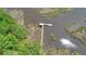 Aerial view of a private dock extending into tranquil waterways, surrounded by lush greenery and natural beauty at 4000 Saltwater Cir, Johns Island, SC 29455