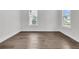 Bright and airy room with hardwood floors and large windows, offering versatile space for various uses at 4000 Saltwater Cir, Johns Island, SC 29455