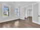 Versatile room with hardwood floors, large windows, and modern trim, offering flexible living space at 4000 Saltwater Cir, Johns Island, SC 29455