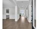 Inviting foyer with hardwood flooring, wainscoting, and an open view of the home's interior at 4000 Saltwater Cir, Johns Island, SC 29455