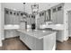 Modern kitchen with grey cabinets, quartz countertops, and pendant lighting at 4000 Saltwater Cir, Johns Island, SC 29455