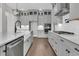 Stylish kitchen with stainless appliances, quartz countertops, and hardwood floors at 4000 Saltwater Cir, Johns Island, SC 29455