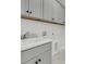 Modern laundry room features white cabinets, sink, and countertop space at 4000 Saltwater Cir, Johns Island, SC 29455