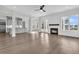 Bright living room with fireplace, hardwood floors, and access to outdoor space at 4000 Saltwater Cir, Johns Island, SC 29455