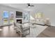 Bright living room features a fireplace, modern decor, large windows and relaxing atmosphere at 4000 Saltwater Cir, Johns Island, SC 29455