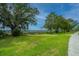 Scenic walking path through the community with views of mature trees, grassy landscapes and glimpses of water views at 4000 Saltwater Cir, Johns Island, SC 29455