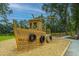 Nautical-themed playground with a wooden ship structure and swings, perfect for outdoor fun and imaginative play at 4000 Saltwater Cir, Johns Island, SC 29455